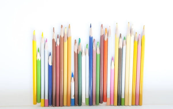 Many colored pencils in a row — Stock Photo, Image