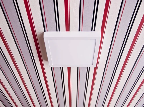 Luminaire (lamp) on the striped ceiling — Stock Photo, Image