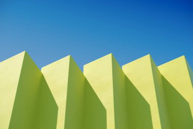 Gökyüzü arka planında gölgeler olan sarı kulübe binası. Asgari mimari fikirler. 3B Hazırlama.