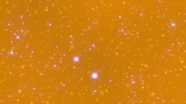 Altın tozu güzel bir bokeh ile geri döndür. Parlak altın parçacıkları, bulanık odak (sığ alan derinliği) ile bulanık, kıvılcım ve döndürme döngülü ışık soyut zemin üzerinde. 4k - 4096x2304, 60 fps.