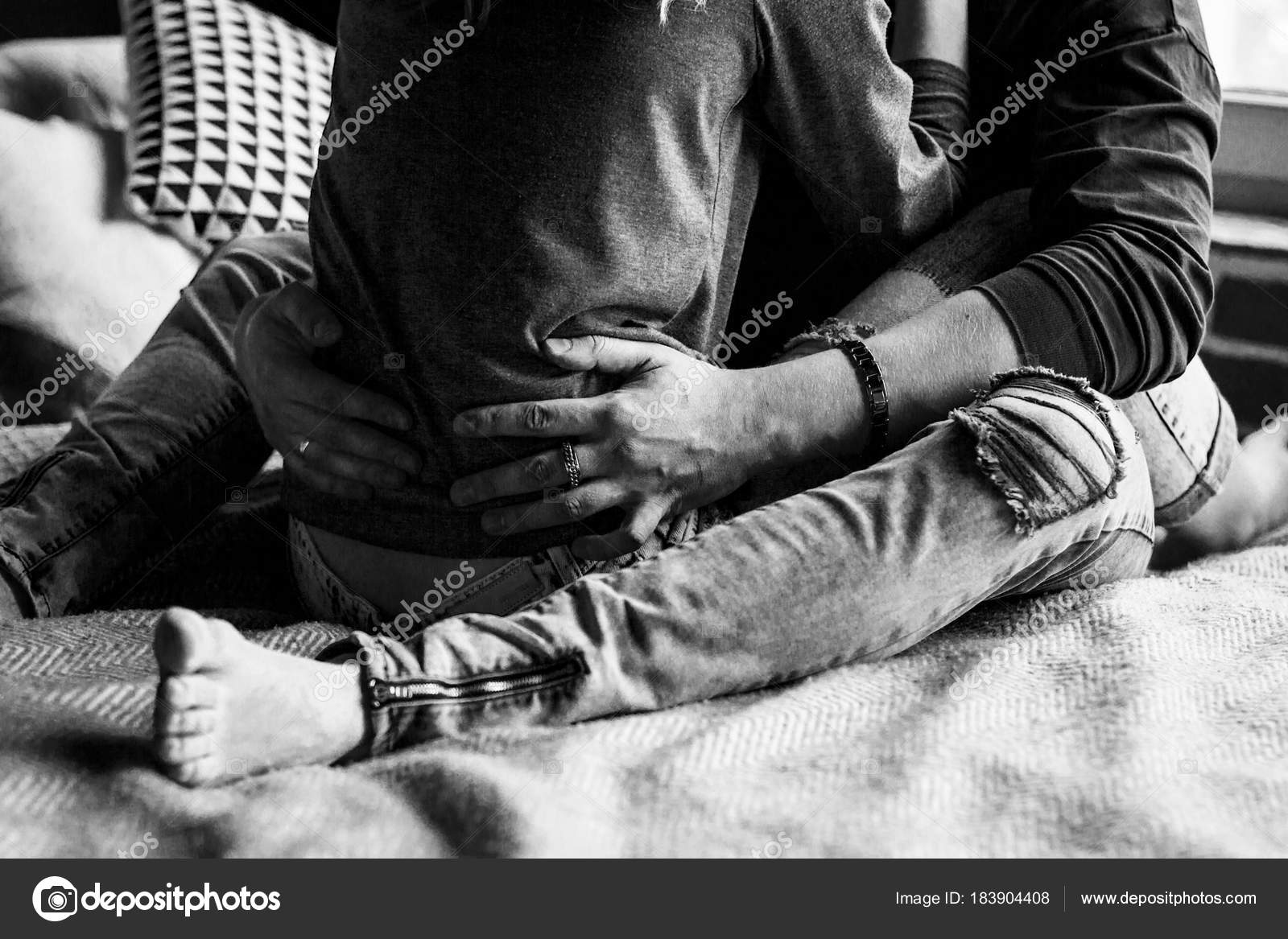 Young beautiful pair of lovers hug and Cropped Legs in