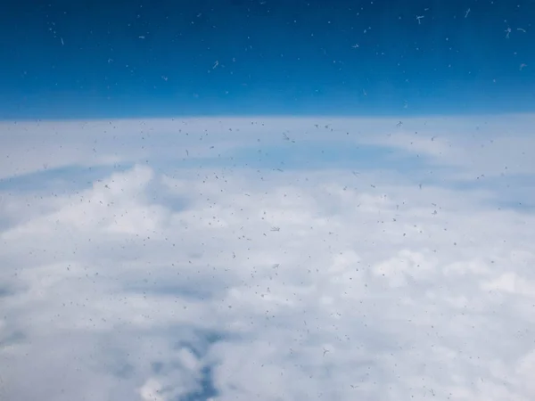 Clouds and clear bright blue sky. Aerial view from plane illuminator — Stock Photo, Image