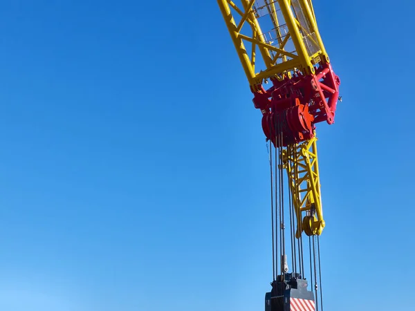 Part of yellow tower crane against blue sky — Stock Photo, Image