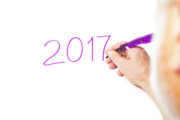 2017. Hand writing numbers, purple pen on white background