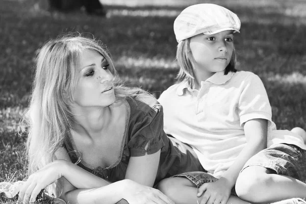 Amicable family on nice grassy lawn monochrome image — Stock Photo, Image