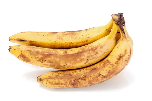 Dojrzałe banany kłamstwie na białym tle — Zdjęcie stockowe