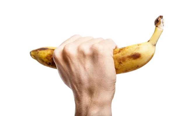 Reife Banane in der Hand Mann auf weißem Hintergrund — Stockfoto