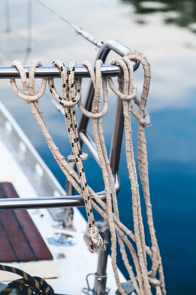 Ropes tied a noose hanging on the fence yacht — Stock Photo, Image