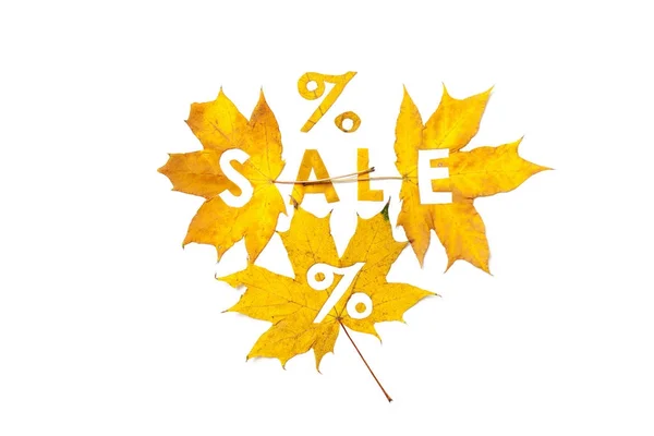 Autumn discounts. Letters are cut from wedge leaves — Stock Photo, Image