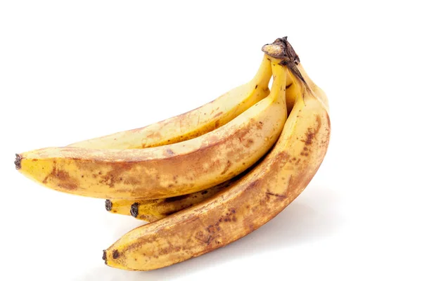 Plátanos maduros yacen sobre fondo blanco — Foto de Stock