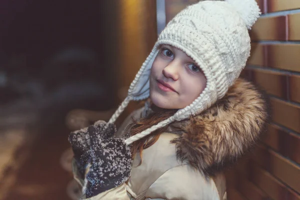 Young girl in winter jacket and knit cap — Stock Photo, Image