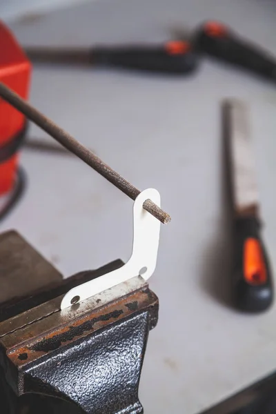 Round file handles hole in flat corner — Stock Photo, Image