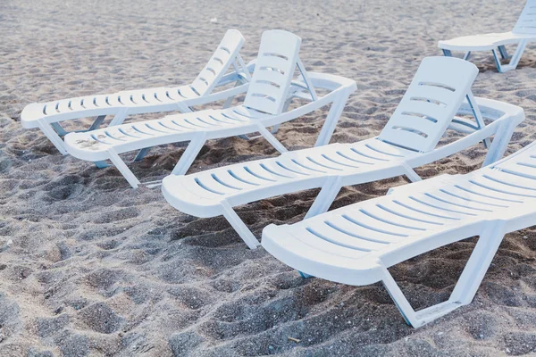 Deck chairs on the sea beach.