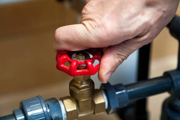 Hand spins valve close-up — Stock Photo, Image