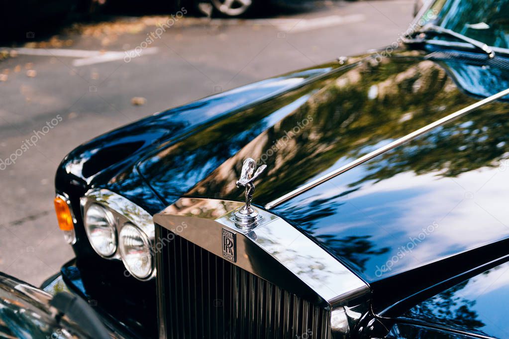 PARIS, FRANCE - SEP 12, 2016; Luxury Rolls-Royce car limousine parked in city during fashion wedding vip event. Rolls-Royce Limited is a British car-manufacturing and, later, aero-engine manufacturing company founded by Charles Stewart Rolls and Sir