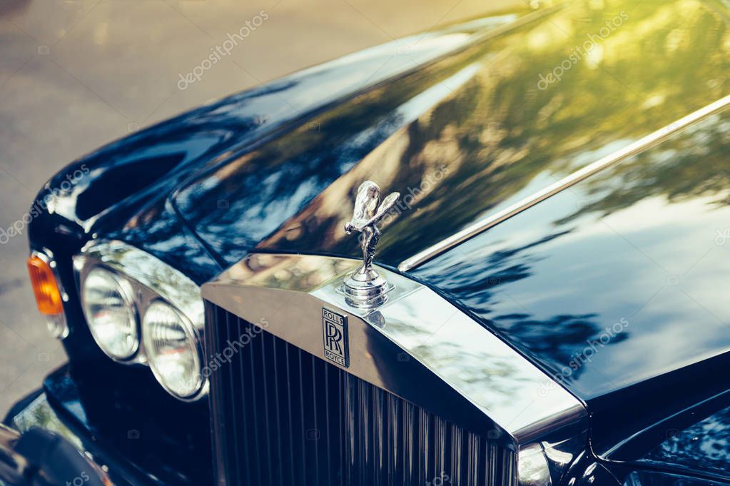PARIS, FRANCE - SEP 12, 2016: Exclusive Luxury Rolls-Royce car limousine parked in city during fashion wedding vip event waiting for passenger. Rolls-Royce Limited is a British car-manufacturing and, later, aero-engine manufacturing company founded b