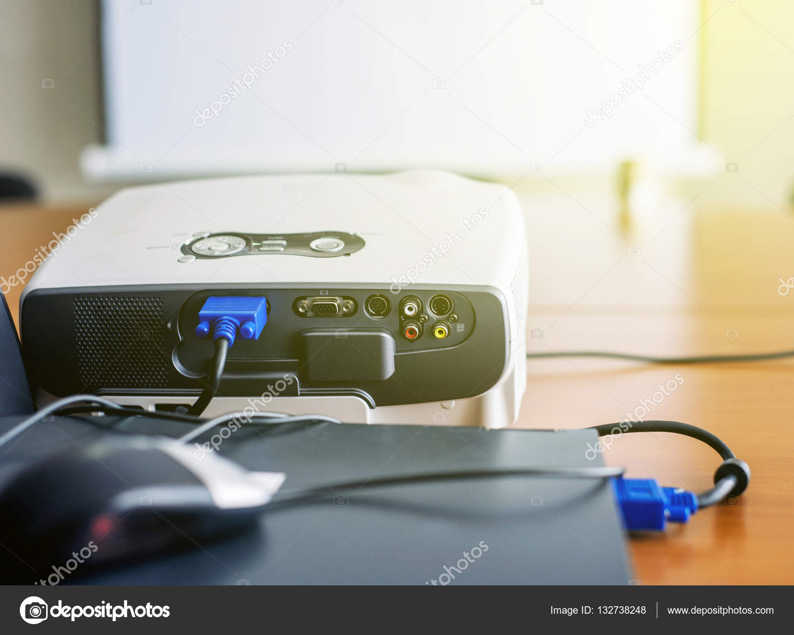 Projector connected to laptop in presentation room Stock Photo by