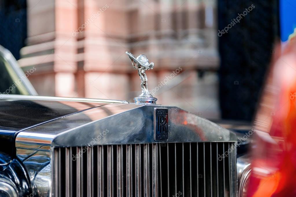 PARIS, FRANCE - SEP 12, 2016: Emblematic and Exclusive Luxury Rolls-Royce car limousine parked in city during fashion wedding vip event waiting for passenger. Rolls-Royce Limited is a British car-manufacturing