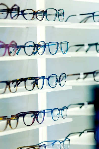 Multiple eyeglasses frames in optical store — Stock Photo, Image