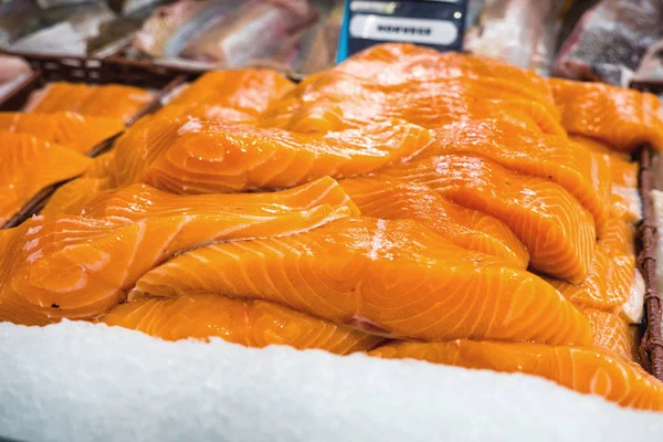 Raw salmon filet on supermarket stall — Stock Photo, Image