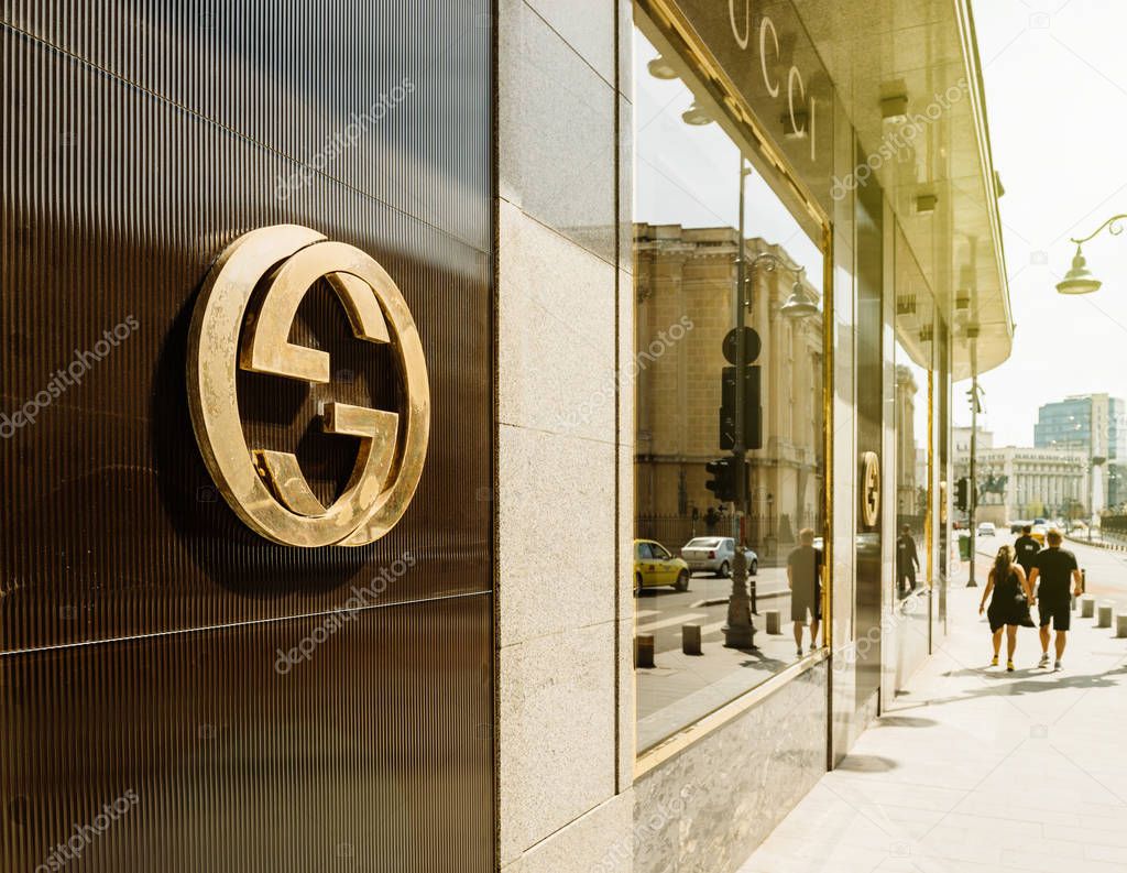 BUCHAREST, FRANCE - APR 1, 2016: Gucci sign logo on fashion store official boutique flagship store in Bucharest. Gucci is a luxury brand known for modern, Italian-crafted leather goods, apparel & accessories for men & women