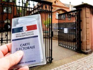Man holding Carte Electorale - voter's card French voter registr clipart