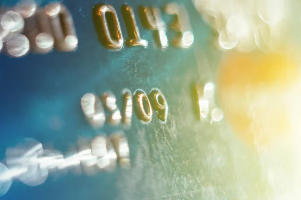 Cartão de crédito desfocado abstrato com clarão solar — Fotografia de Stock