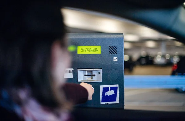 Woman paying ticket parking time space digital display — Stock Photo, Image