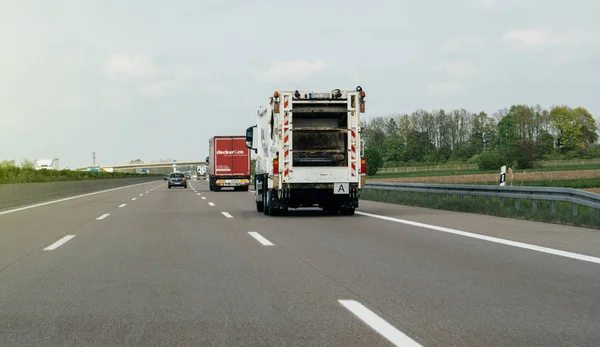 Garbage truck driving fast on highway — Stock Photo, Image