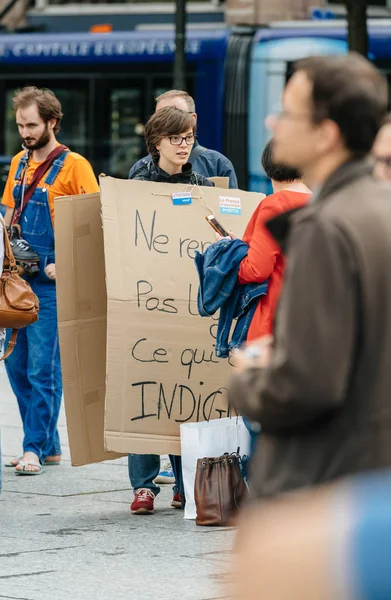 Woman wearing cardboard placard at placard against Macron — Stock Photo, Image