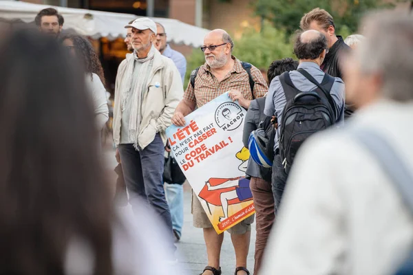 Senior man with placard against macron at protest in France — Stock Photo, Image