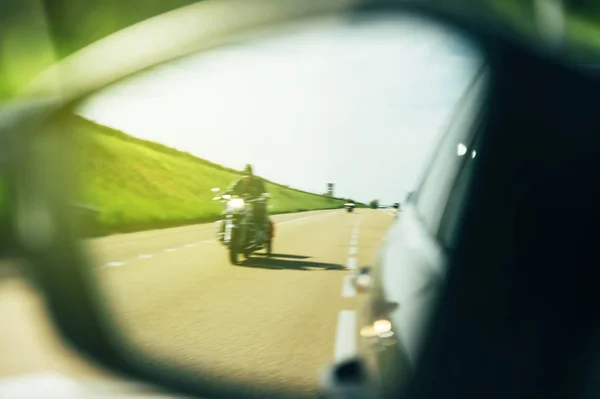 Driver point of view in rear view mirror — Stock Photo, Image