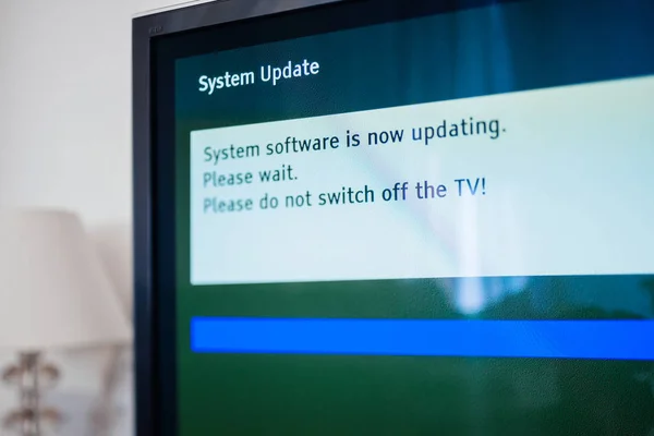 System update software process on a modern television set — Stock Photo, Image