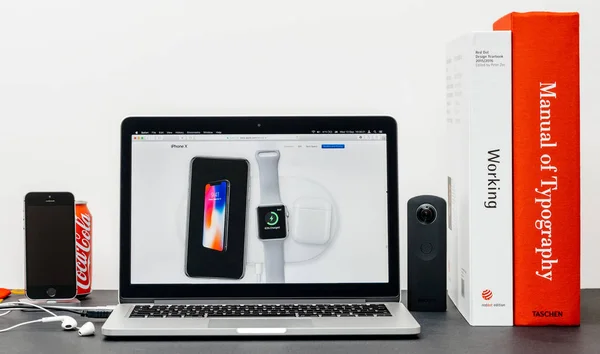 Latest iPhone X 10 with apple watch next to aircharger, apple wa — Stock Photo, Image