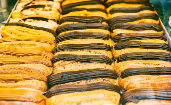 Traditional sweets France showcase window eclairs — Stock Photo, Image