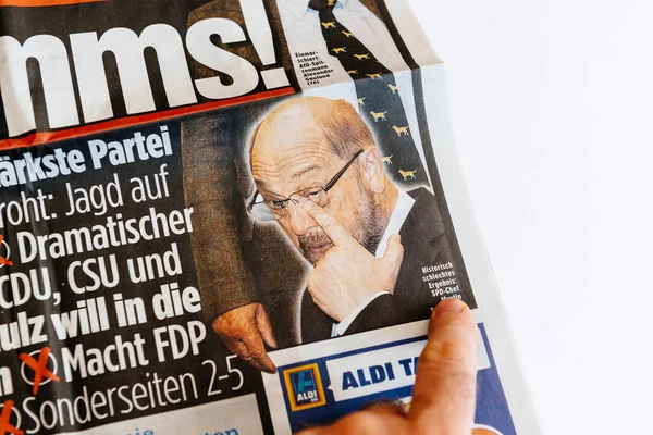 Man reading German newspaper — Stock Photo, Image