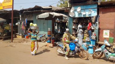 Generic shopping street of the Bamako with people selling on the streets diverse objects clipart