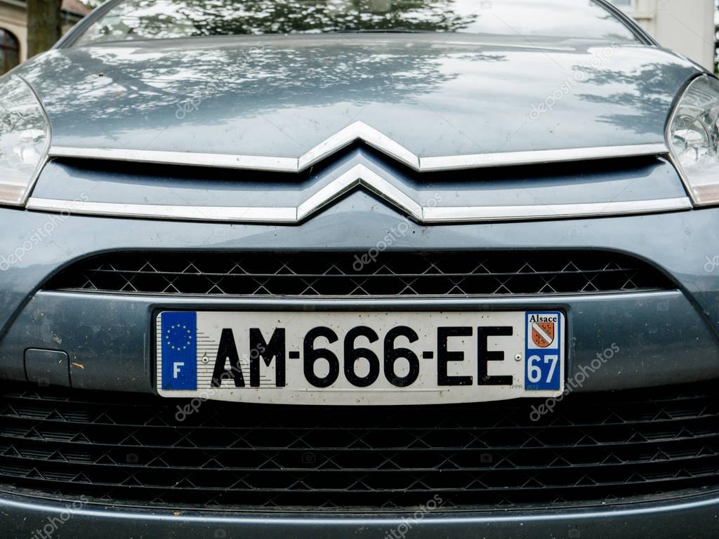 PARIS, FRANCE - JUN 25, 2017: French Citroen limousine car parked on the street of a French city with 666 lucky devil plate number