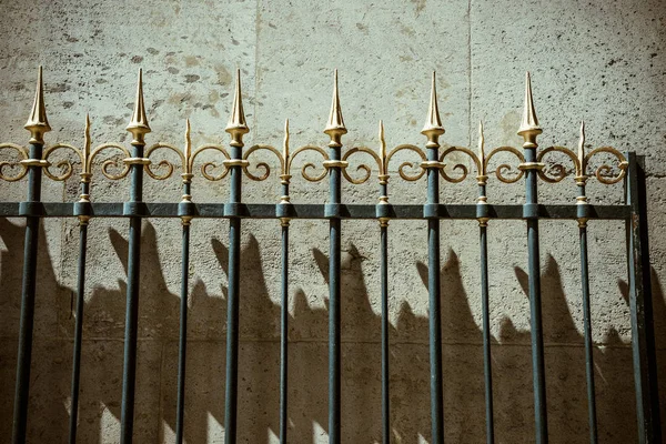 Vintage fence decoration with shadows simestone wall — Stock Photo, Image