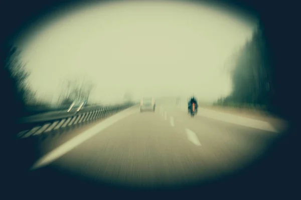 Pursuit concept in blur motion rear view of cool hipster biker m — Stock Photo, Image