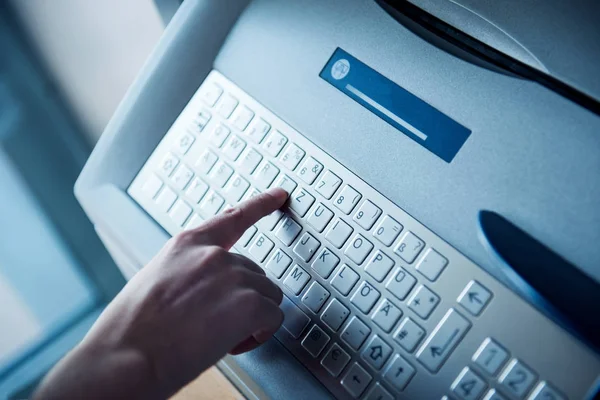 Using modern ATM keyboard  press T letter — Stock Photo, Image