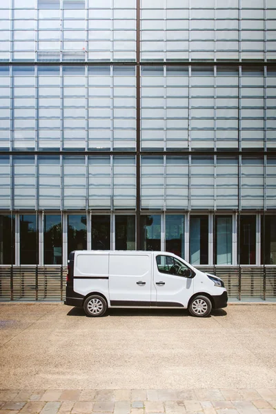 White delivery service wan parked in front of modern office indu — Stock Photo, Image