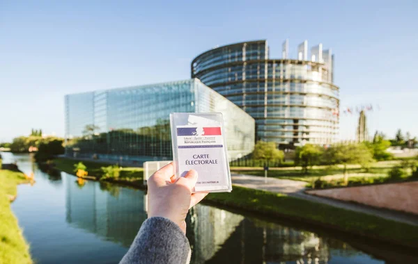 Woman holding French voter registration card Carte Electorale wi — Stock Photo, Image