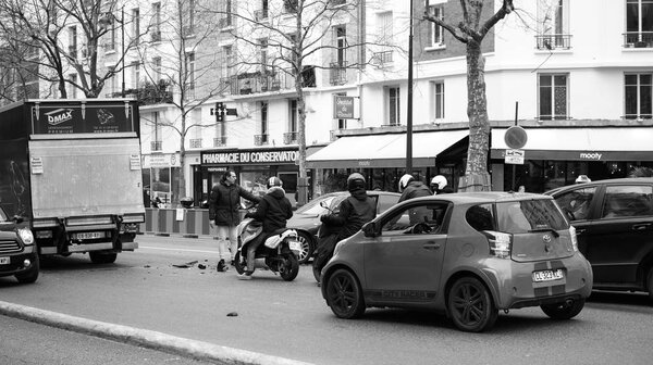 Car accident on PAris street between luxury limousine Lancia Th