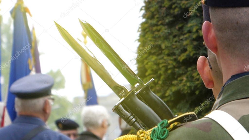 Solider holding gun at parade in France 