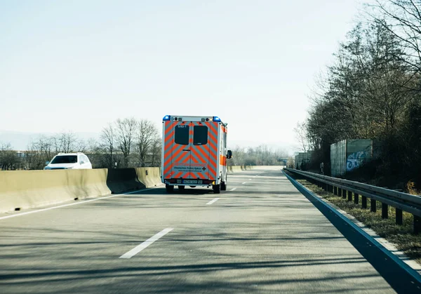 Deutsches Rotes Kreuz ambulance on German rural road — Stock Photo, Image