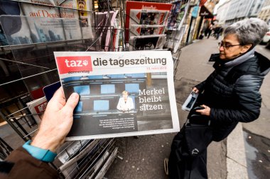 die tageszeitung Newspaper at press kiosk featuring Angela Dorot clipart