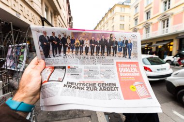 Newspaper at press kiosk featuring Angela Dorothea Merkel re ele clipart