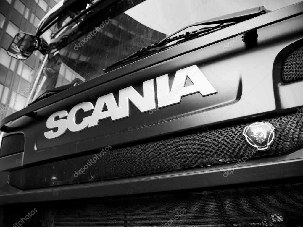STRASBOURG, FRANCE - MAR 5, 2018: Side view of Scania logotype insignia logo on the front part of the radiator of a powerful G410 truck new Swedish truck - black and white