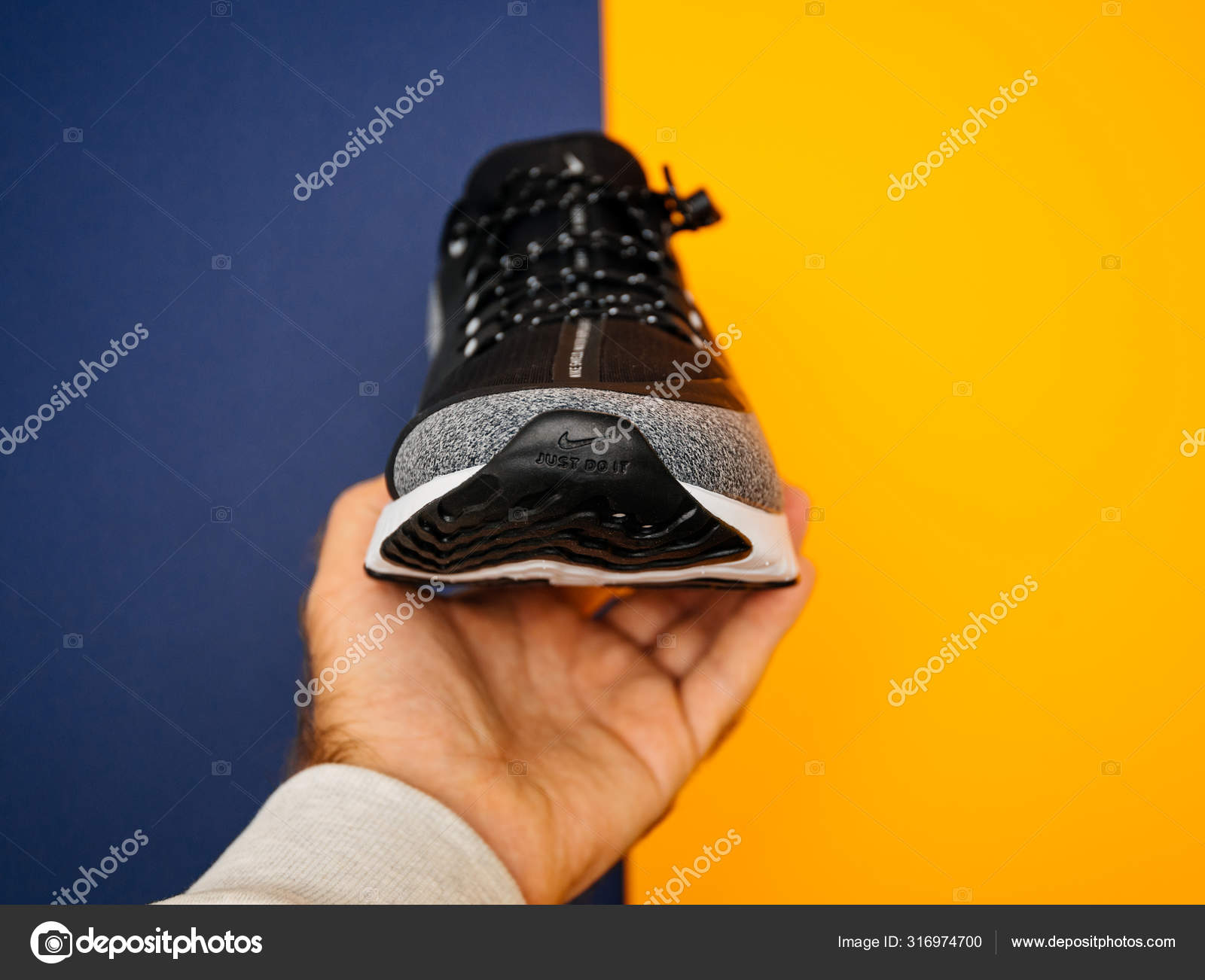 Man hand holding new Nike Running Shoe Odyssey React Shield – Stock  Editorial Photo © ifeelstock #316974700